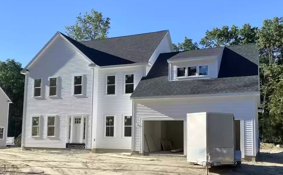 Custom home at 270 Quinapoxet at dusk